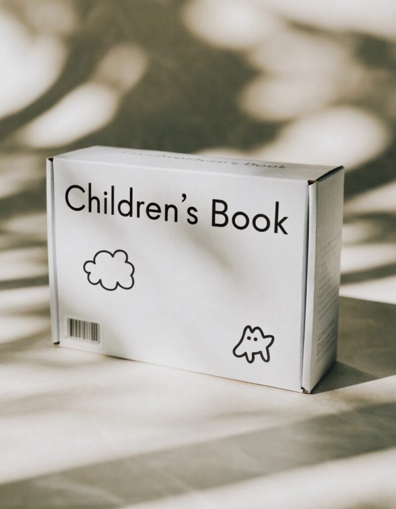 Whitechildren'ss book box in a bright nursery with organized picture books and cozy reading corner